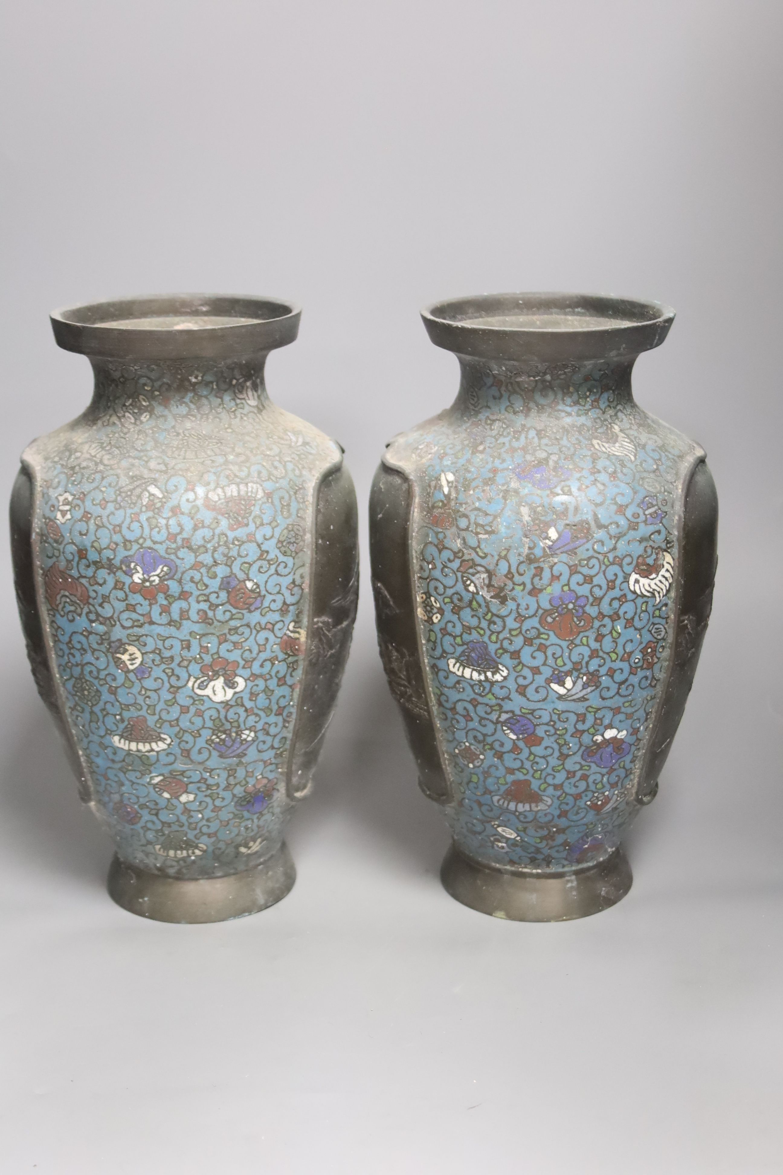 A pair of Japanese champleve enamel vases, height 30cm